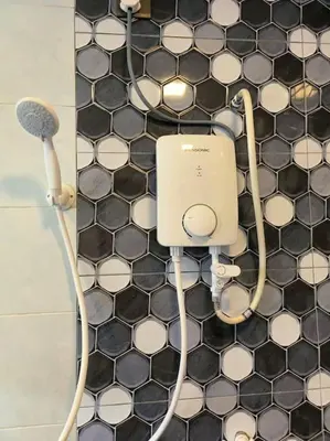 a bathroom with a shower with aconnected at (WI-FI) Ipoh Holiday Big House double storey DR8 in Ipoh
