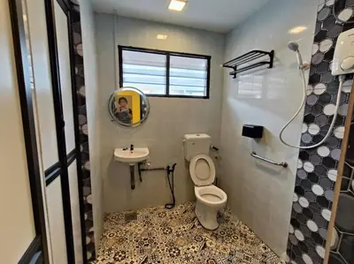 a bathroom with a toilet and a sink and a mirror at (WI-FI) Ipoh Holiday Big House double storey DR8 in Ipoh