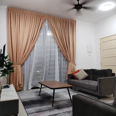a living room with a couch and a window at ART CASIA HOMESTAY BERTAM in Kepala Batas