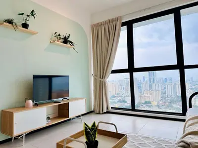a living room with a tv and a large window at New Comfy Urban Suite Homestay at Georgetown for family by Urban Staycations LOD COSY in Jelutong
