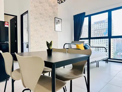 a dining room with a table and chairs at New Comfy Urban Suite Homestay at Georgetown for family by Urban Staycations LOD COSY in Jelutong