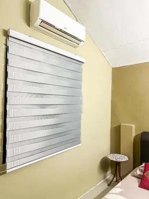 a blind on a window in a room at Dusun Indah Cottage 3 in Bayan Lepas