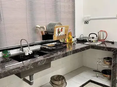 a kitchen with a sink and a counter top at Juzt Homestay Kpg Boyan in Taiping