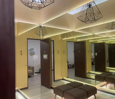 a lobby with mirrors and a waiting room at Sogor Female Dormitory in George Town