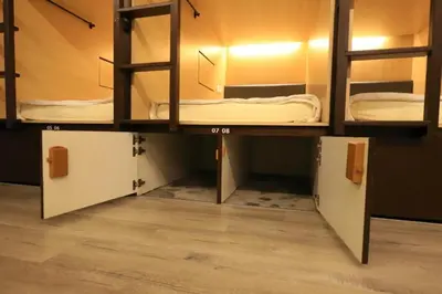 a room with three bunk beds in a room at Sogor Female Dormitory in George Town