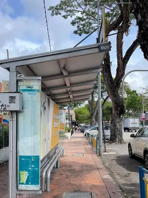a bus stop with a canopy on a sidewalk at Sogor Female Dormitory in George Town