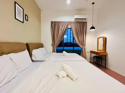 a bedroom with two white beds and a window at (New) Beachside Antique Villa@14 pax in George Town