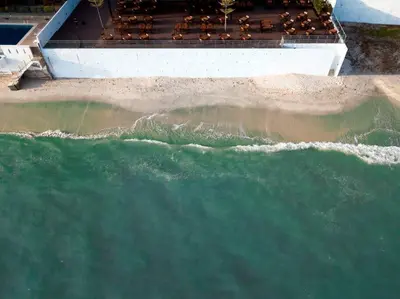 an overhead view of a wave in the ocean at (New) Beachside Antique Villa@14 pax in George Town