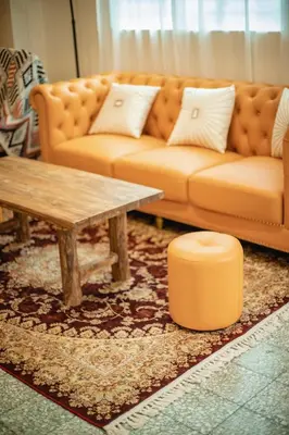 a living room with a couch and a coffee table at FA House by the Beach in Tanjung Bungah