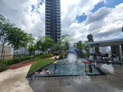 a water park with a water slide and people in it at Executive Premium Urban Suites - Jelutong in Jelutong