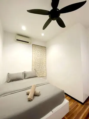 a bedroom with a bed with a ceiling fan at CozyHouse 4ROOM 4BATH ROOM 8PAX@Near BM Icon city in Bukit Mertajam