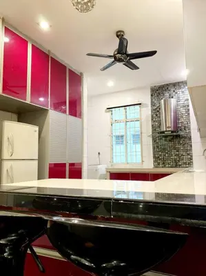 a kitchen with a ceiling fan and red cabinets at CozyHouse 4ROOM 4BATH ROOM 8PAX@Near BM Icon city in Bukit Mertajam