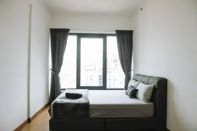 a bedroom with a bed with a large window at The ELM, 2BR Cityview by W. Stay @ Tropicana 218 Macalister in George Town