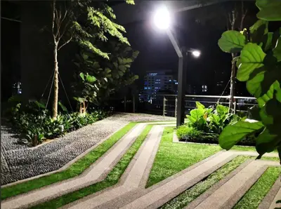a park at night with a street light and grass at The ELM, 2BR Cityview by W. Stay @ Tropicana 218 Macalister in George Town