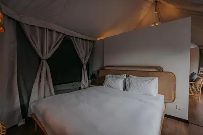 a bedroom with a bed in a tent at Safari Tent with Private Jacuzzi in Brinchang