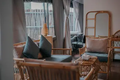 a living room with a couch and chairs and a window at Safari Tent with Private Jacuzzi in Brinchang