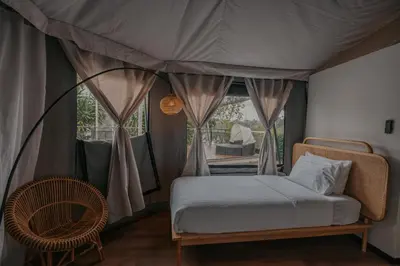 a bedroom with a bed in a tent at Safari Tent with Private Jacuzzi in Brinchang