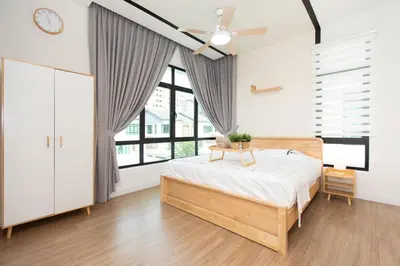 a bedroom with a bed and a large window at Muji Style 5BR Ferringhi Beach House 15Pax in Batu Ferringhi