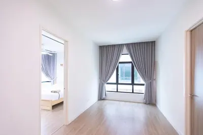 an empty white room with a bed and a window at Muji Style 5BR Ferringhi Beach House 15Pax in Batu Ferringhi