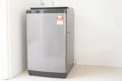 a refrigerator in a room with a white wall at Muji Style 5BR Ferringhi Beach House 15Pax in Batu Ferringhi