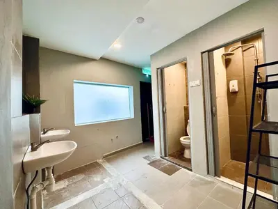 a bathroom with two sinks and a toilet at Georgetown landed Guest House WL in George Town