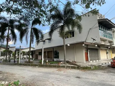 a white house with palm trees in front of it at GOPENG INN Homestay in Gopeng