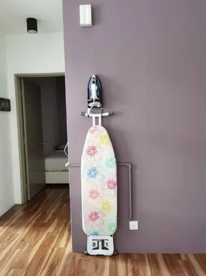 a skateboard is hanging on a door in a room at G Residence - 2BR Family Suite Barrington Night Market - 4 in Brinchang