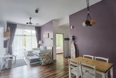a living room with a table and a couch at G Residence - 2BR Family Suite Barrington Night Market - 4 in Brinchang