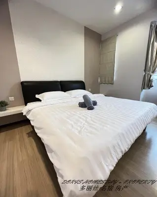 a large white bed with a stuffed animal on it at 10pax -2 Storey House Bayu Mutiara at Bukit Mertajam in Bukit Mertajam