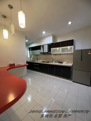 a large kitchen with black cabinets and white tile floors at 10pax -2 Storey House Bayu Mutiara at Bukit Mertajam in Bukit Mertajam
