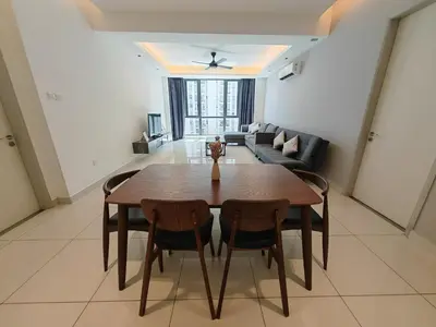 a living room with a wooden table and chairs at Harmony Haven with Bathtub - Jazz Suites by Ocean Luxe in Tanjong Tokong
