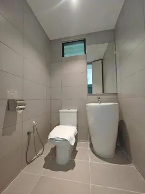 a bathroom with a white toilet and a mirror at Harmony Haven with Bathtub - Jazz Suites by Ocean Luxe in Tanjong Tokong