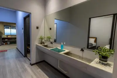 a bathroom with a sink and a large mirror at 5R4B 15Pax V KTV,KID'S POOL,POOL TABLE NEAR USM,LWE HOSPITAL,SPI ARENA in George Town