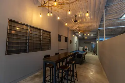a dining room with a table and some chairs at -NEW- 22Pax 5R4B V KTV,KID'S POOL,POOL TABLE NEAR USM,LWE HOSPITAL,SPI ARENA in George Town