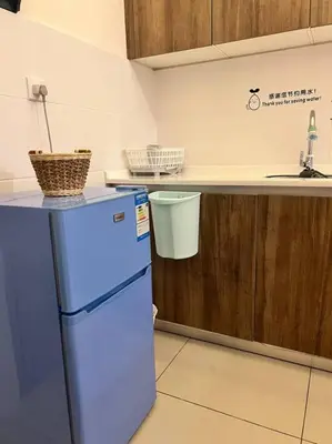a kitchen with a blue refrigerator and a counter at Lily Fair ~ Cameron Highlands in Tanah Rata