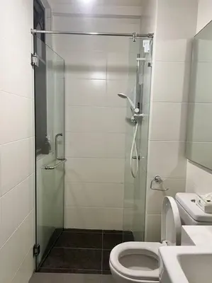 a bathroom with a shower and a toilet and a sink at Lily Fair ~ Cameron Highlands in Tanah Rata