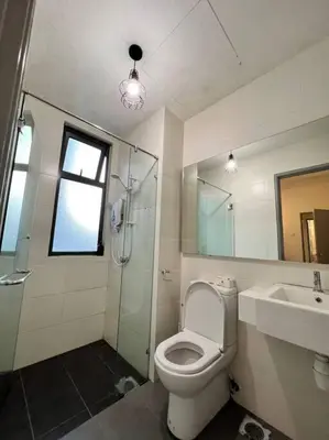 a bathroom with a toilet and a shower and a sink at Lily Fair ~ Cameron Highlands in Tanah Rata