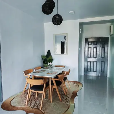 a dining room with a table and chairs at D'Elegant Suite - Emerald Avenue in Cameron Highlands