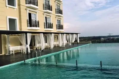 a large pool of water in front of a building at Champs Elysees by Landmark @ Kampar in Kampong Malim Nawar
