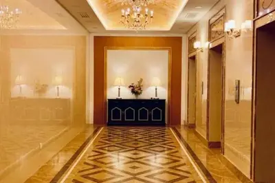 a hallway of a hotel with a door and a table at Champs Elysees by Landmark @ Kampar in Kampong Malim Nawar