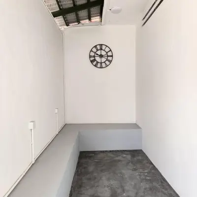 a white room with a clock on the wall at Ipoh town centre - safari 5 pax(2BR) in Ipoh