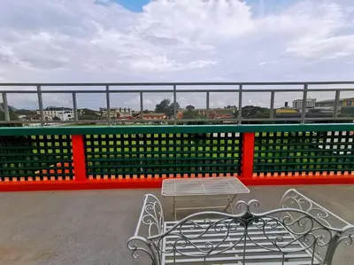 a bench and a table on top of a building at Ipoh town centre - safari 5 pax(2BR) in Ipoh