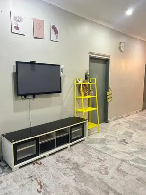 a living room with a flat screen tv on a wall at Hz Homestay Bertam in Kepala Batas