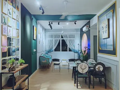 a dining room with blue walls and a table and chairs at Moon Classic Falim by Irainbow in Ipoh