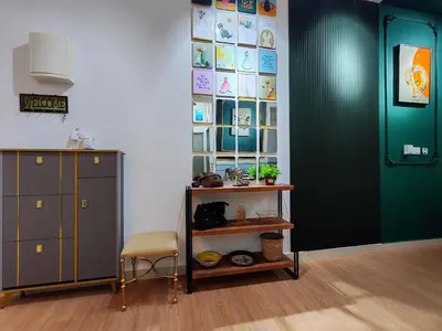 a room with a green door and a chair and a shelf at Moon Classic Falim by Irainbow in Ipoh