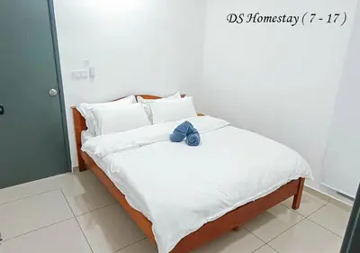 a bed with a stuffed animal sitting on top of it at Metropol Serviced Apartment Nice Pool View 3 BR in Bukit Mertajam