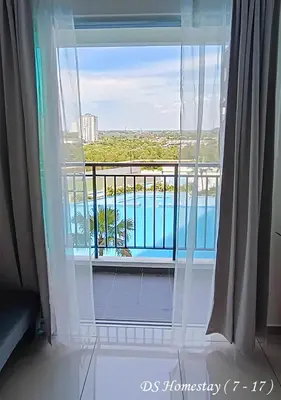 a room with a window with a view of a pool at Metropol Serviced Apartment Nice Pool View 3 BR in Bukit Mertajam