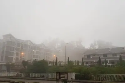 a foggy city with houses and buildings in the background at Cosy 2-Storey Holiday Home Vines 2 @Pasar Malam -1 in Brinchang