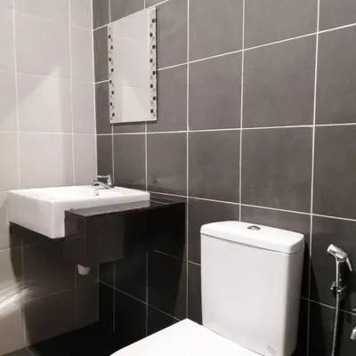 a bathroom with a white toilet and a sink at Cosy 2-Storey Holiday Home Vines 2 @Pasar Malam -1 in Brinchang