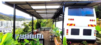 a large white truck parked under a roof at Campod Resort @ Cameron Highlands in Cameron Highlands